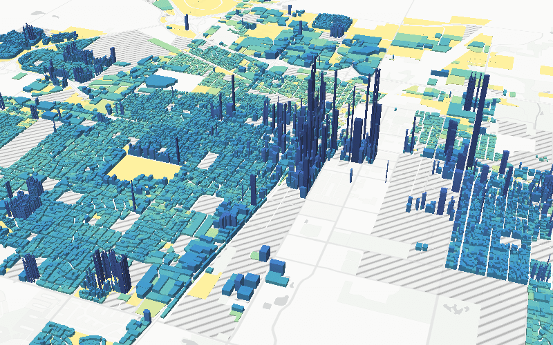 3D map of property value per acre in Champaign, with tall spikes downtown and in Campustown